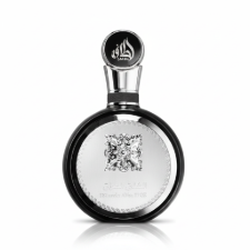 Silk and Sillage Lattafa Fakhar 100ML perfume bottle with ornate gold and black design on a decorative background.