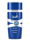 Silk and Sillage Lattafa Asad Zanzibar 100ml perfume bottle, deep blue glass with silver metallic bands.